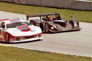 Jon Field / Oliver Gavin Lola B2K/10 Judd passes the Andy McNeil / Doug Mills / Kerry Hitt Chevy Camaro