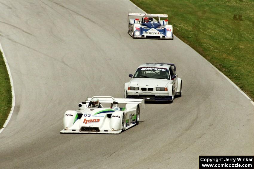 Howard Katz / Jim Downing Kudzu DLY/Mazda leads a pair of cars into turn 7