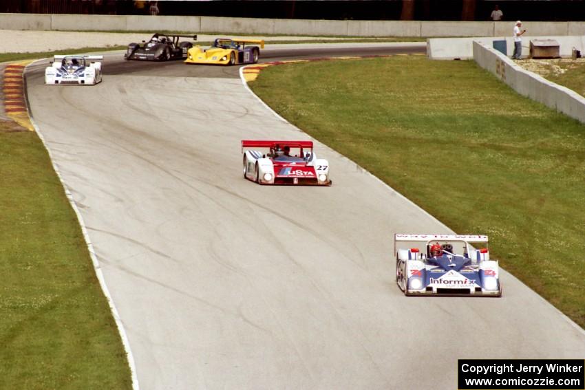 The front-runners start passing the SRII cars and are still bunched together between turns 6 and 7.