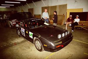 Jens Larsen / Bob Barrall Mazda RX-7 heads through tech inspection.