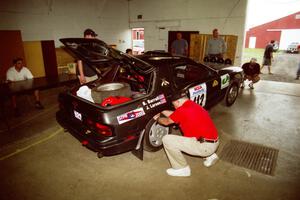 Jens Larsen / Bob Barrall Mazda RX-7 head through tech inspection.