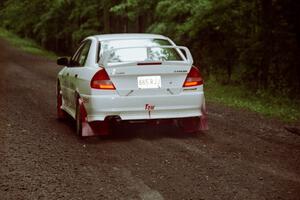 Seamus Burke / Frank Cunningham Mitsubishi Lancer Evo IV launches from the start of the practice stage.