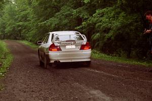 Érik Comas / Julian Masters Mitsubishi Lancer Evo IV launches from the start of the practice stage.