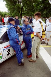 Noel Lawler and Charles Bradley are interviewed by Jeff Burmeister in front of their Hyundai Tiburon before the rally.