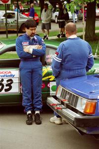 Tad Ohtake and Mark Utecht converse at parc expose before the rally.