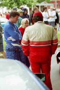 George Plsek, Renn Phillips and Ralph Kosmides converse at parc expose before the rally.