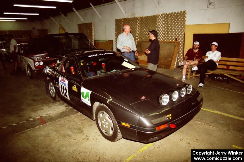 Jens Larsen / Bob Barrall Mazda RX-7 heads through tech inspection.