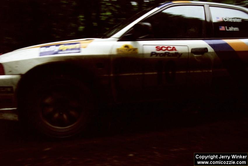 Pete Lahm / Matt Chester Mitsubishi Lancer Evo IV launches from the start of the practice stage.