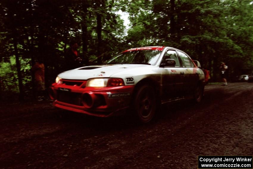 Garen Shrader / Doc Schrader Mitsubishi Lancer Evo IV launches from the start of the practice stage.