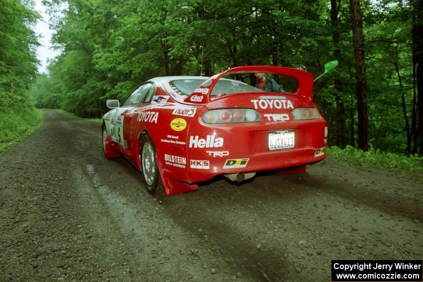 Ralph Kosmides / Ken Cassidy Toyota Supra Turbo launches from the start of the practice stage.