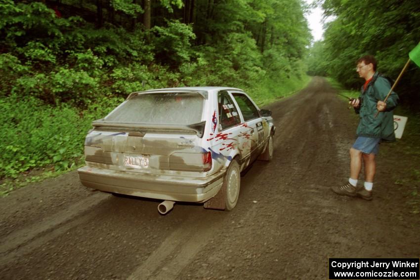 Marty Allen / Peter Watt Mazda 323GTX launches from the start of the practice stage.