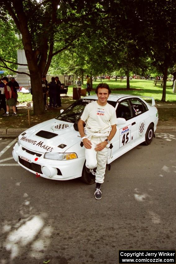 Érik Comas in front of the Mitsubishi Lancer Evo IV he and Julian Masters shared for the event.