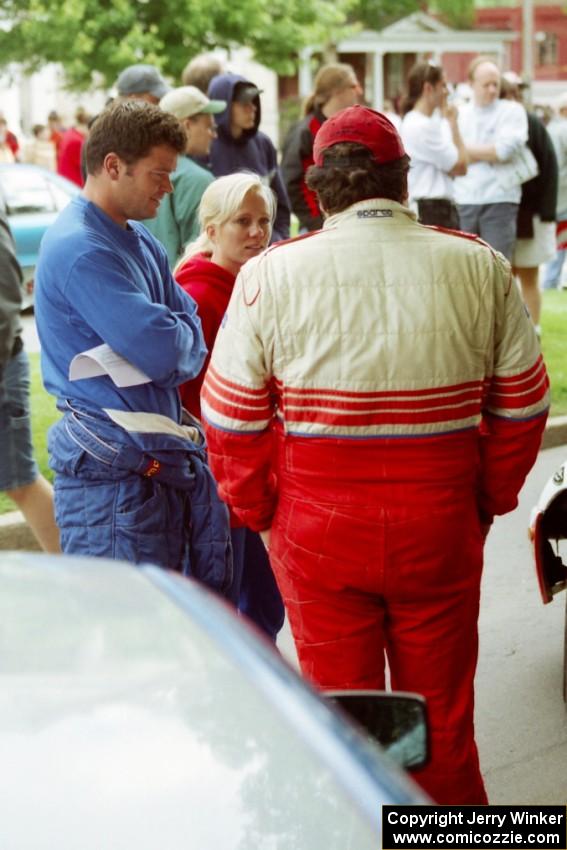 George Plsek, Renn Phillips and Ralph Kosmides converse at parc expose before the rally.