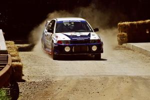 Karl Scheible / Russ Hughes Mitsubishi Lancer Evo V at the Asaph Campground spectator location on SS4, Phasa.