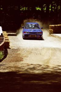 Peter Cunningham / Jim Gill Mitsubishi Lancer Evo VI at the Asaph Campground spectator location on SS4, Phasa.