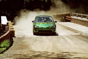 Tad Ohtake / Bob Martin Ford Escort ZX2 at the Asaph Campground spectator location on SS4, Phasa.