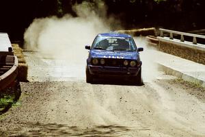 Patrick Lilly / Mark McAllister VW GTI at the Asaph Campground spectator location on SS4, Phasa.