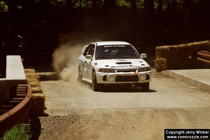 Érik Comas / Julian Masters Mitsubishi Lancer Evo IV at the Asaph Campground spectator location on SS4, Phasa.