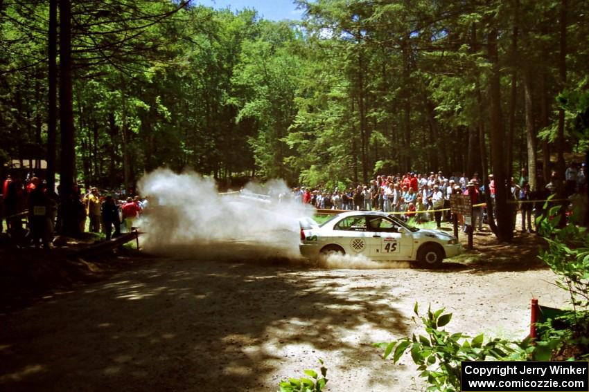 Érik Comas / Julian Masters Mitsubishi Lancer Evo IV at the Asaph Campground spectator location on SS4, Phasa.