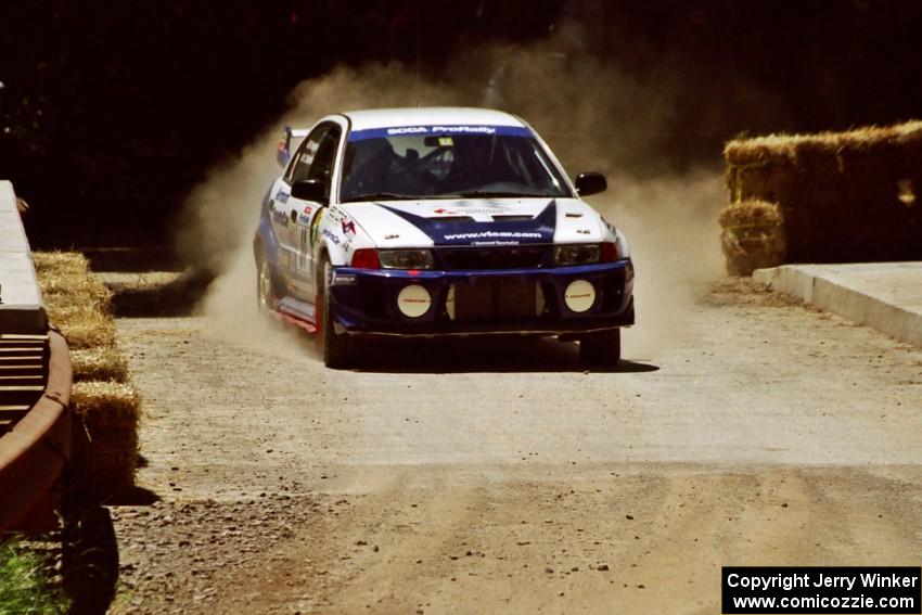 Karl Scheible / Russ Hughes Mitsubishi Lancer Evo V at the Asaph Campground spectator location on SS4, Phasa.