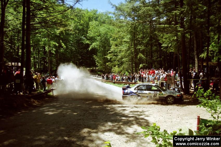 Karl Scheible / Russ Hughes Mitsubishi Lancer Evo V at the Asaph Campground spectator location on SS4, Phasa.