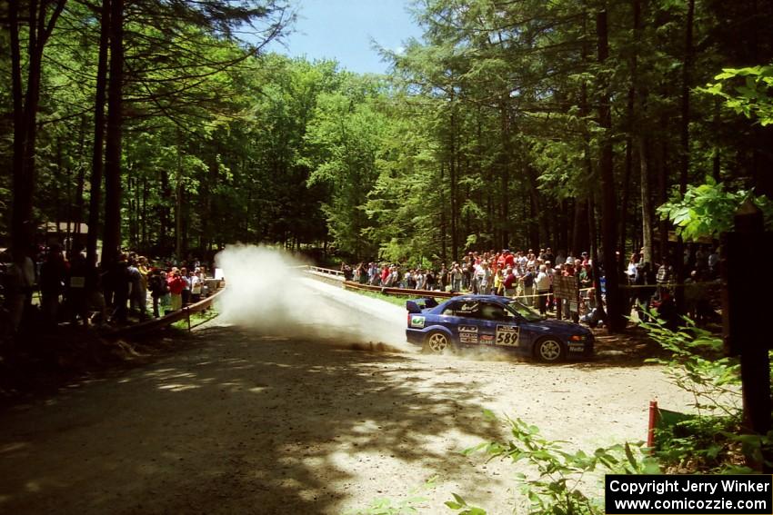 Peter Cunningham / Jim Gill Mitsubishi Lancer Evo VI at the Asaph Campground spectator location on SS4, Phasa.