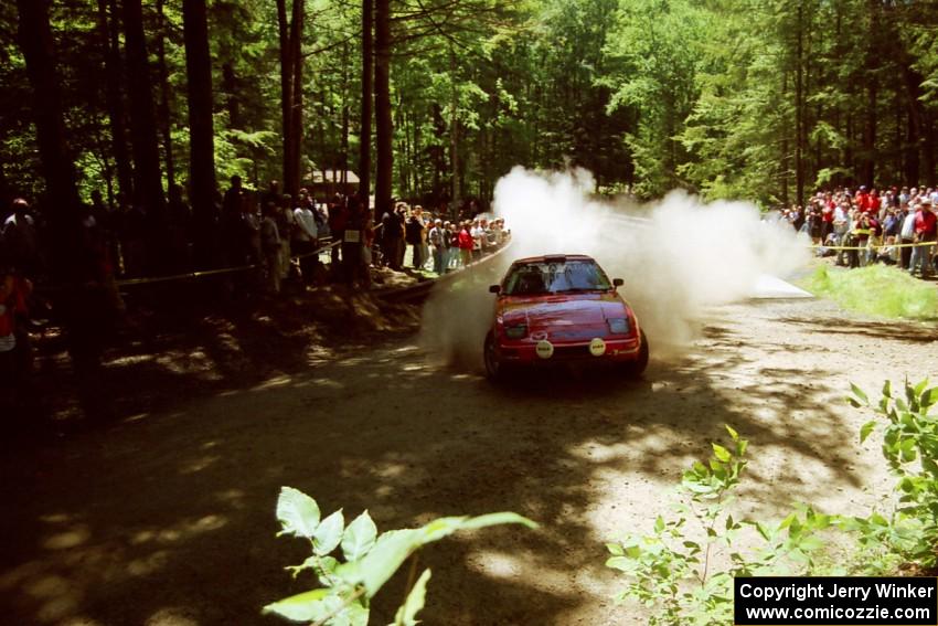 Andrew Havas / Scott Slingerland Mazda RX-7 goes off at the Asaph Campground spectator location on SS4, Phasa.