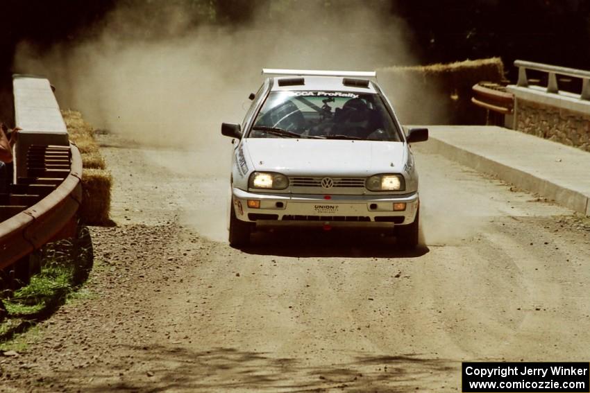 Brad Hawkins / Adrian Wintle VW GTI at the Asaph Campground spectator location on SS4, Phasa.