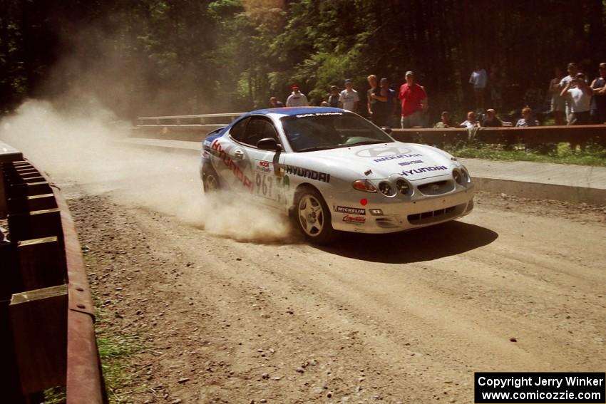 Andy Bornhop / Mark Williams Hyundai Tiburon at the Asaph Campground spectator location on SS4, Phasa.