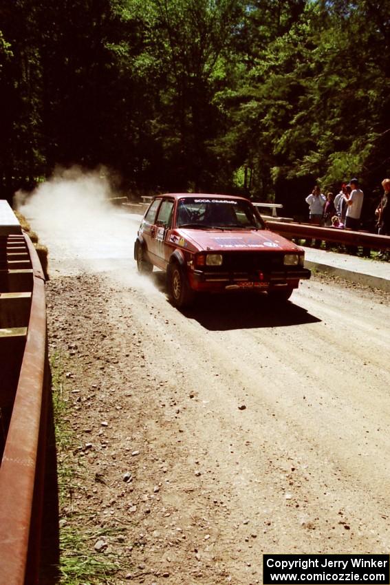 Scott Williams / Trisha Williams VW GTI at the Asaph Campground spectator location on SS4, Phasa.