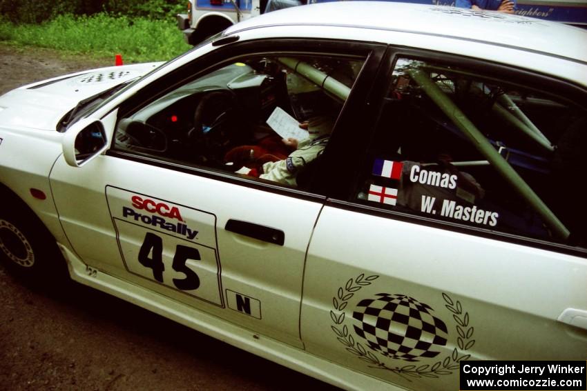 Érik Comas / Julian Masters Mitsubishi Lancer Evo IV at the start of the practice stage.