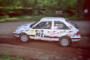 Marty Allen / Peter Watt Mazda 323GTX at the first hairpin on SS8, Rim Stock.