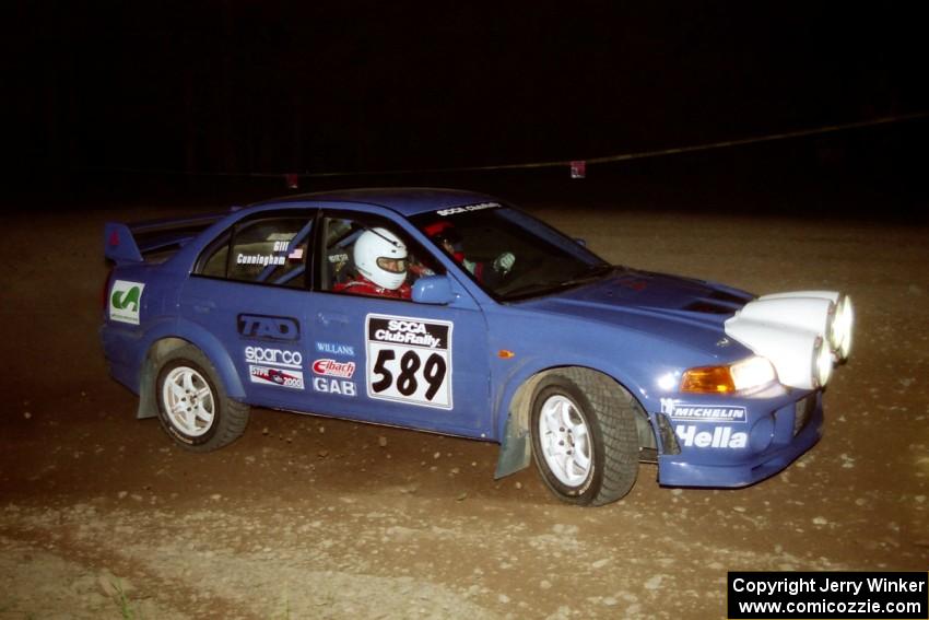 Peter Cunningham / Jim Gill Mitsubishi Lancer Evo VI at the first hairpin on SS8, Rim Stock.