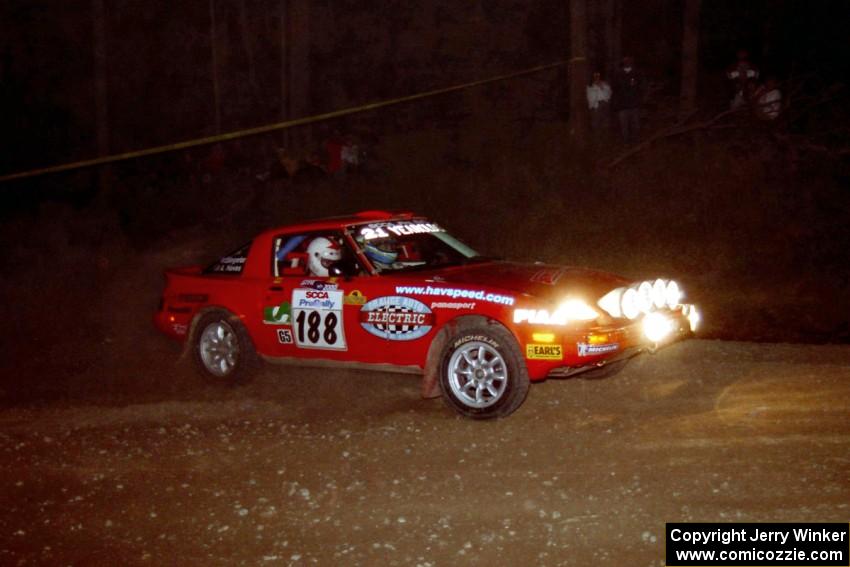 Andrew Havas / Scott Slingerland Mazda RX-7 at the first hairpin on SS8, Rim Stock.