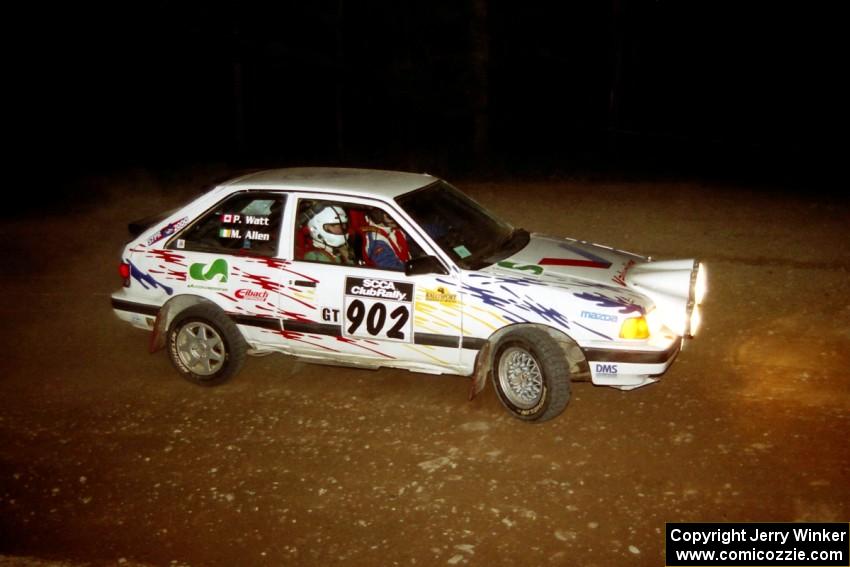 Marty Allen / Peter Watt Mazda 323GTX at the first hairpin on SS8, Rim Stock.