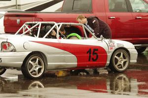 NNM Motorsports Dodge Neon in the paddock receiving work mid-race.