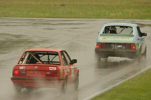 E30 Bombers BMW 325i follows the Fart-hinder SAAB 900 into turn 12.