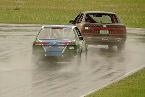 Dirty Thirty Motorsports BMW 325i chases the Eggboy Racing Ford Taurus SHO