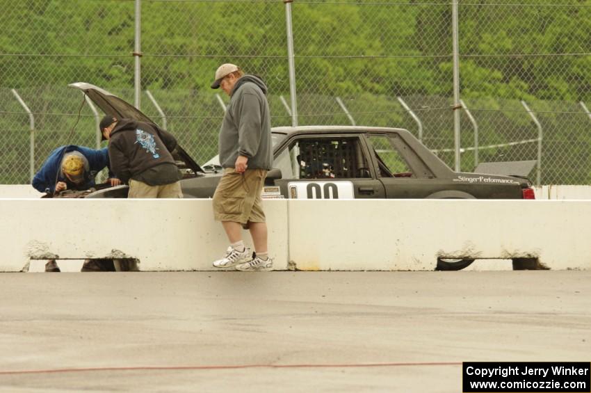 Wells Mafia Ford Mustang in the pits for a lengthy stop.