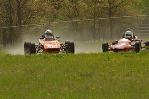 Rich Stadther's Dulon LD-9 Formula Ford gets into the oil dry as Jeff Ingebrigtson's Caldwell D9 Formula Ford follows.