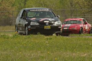 Tom Daly's T4 VW Rabbit and Lon Blaser's Spec Miata Mazda Miata