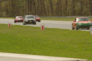 Four cars come into turn 4.