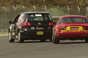 Tom Daly's T4 VW Rabbit ahead of Greg Youngdahl's Spec Miata Mazda Miata