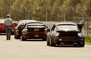 Tom Fuehrer's SPO Ford Mustang, Phil Magney's ITE-1 Porsche 993 and Craig Stephens' ITE-1 Porsche 911 on the pre-grid.