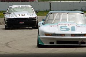 Guy Dirkin's GT-1 Olds Cutlass Supreme ahead of Tom Fuehrer's SPO Ford Mustang