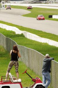 Shannon Ivey's Porsche 911SC is photographed by a spectator while headed into turn 1.