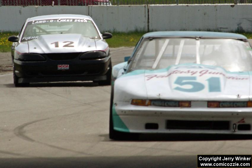 Guy Dirkin's GT-1 Olds Cutlass Supreme ahead of Tom Fuehrer's SPO Ford Mustang