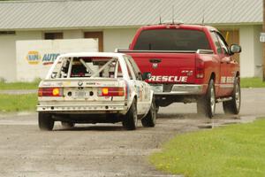 Tubby Butterman Racing 2 BMW 325 gets towed back to the paddock.