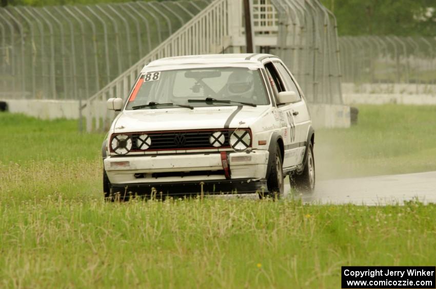 JAB Motorsport VW GTI slides off the track at turn 12.