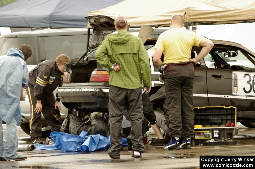 Ambitious But Rubbish Racing BMW 325 in the paddock for a lengthy stop.